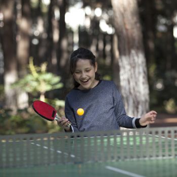Young Girl Playing Table Tennis